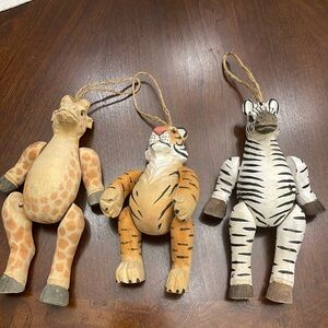 Three hand carved jointed Zebra, tiger and Giraffe ornaments